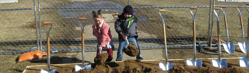 2 Kindergarten students breakground for the New K-2 building they will attend.